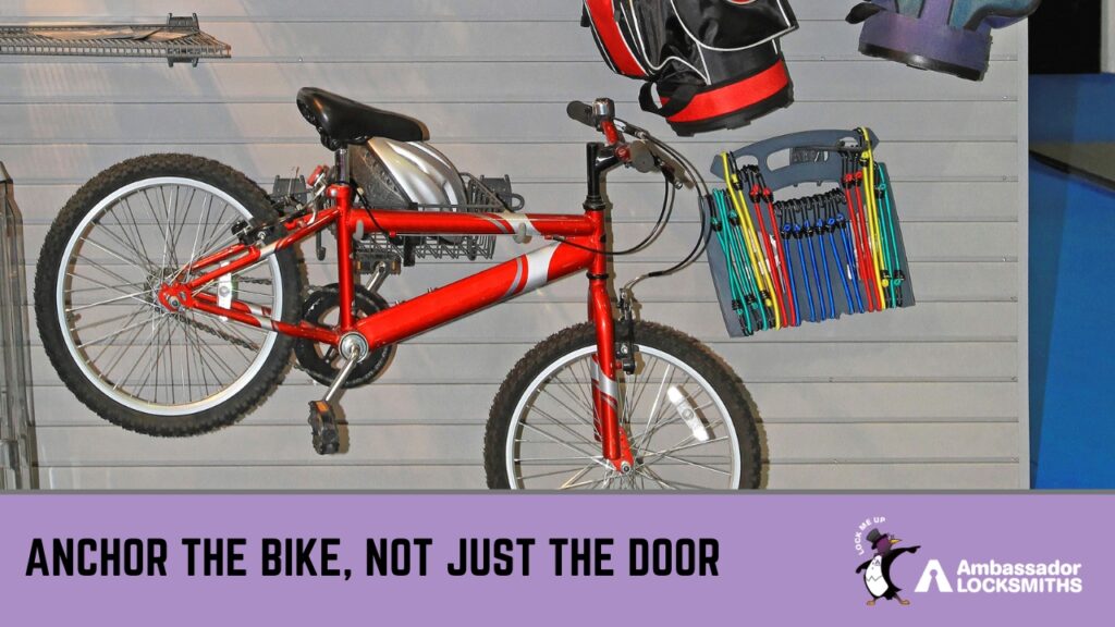 Easy Methods to Secure Outdoor Tools and Bikes from Theft » bike Red bicycle hanging on a slatwall storage system alongside golf bags and bungee cords